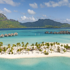 Aerial view of The Westin Bora Bora Resort & Spa surrounded by turquoise lagoon waters, lush tropical landscapes, and iconic overwater villas in the heart of French Polynesia.