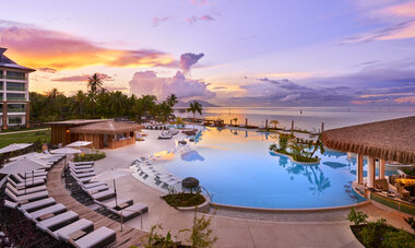 Hilton Tahiti Resort Pool and Pool bar at sunset
